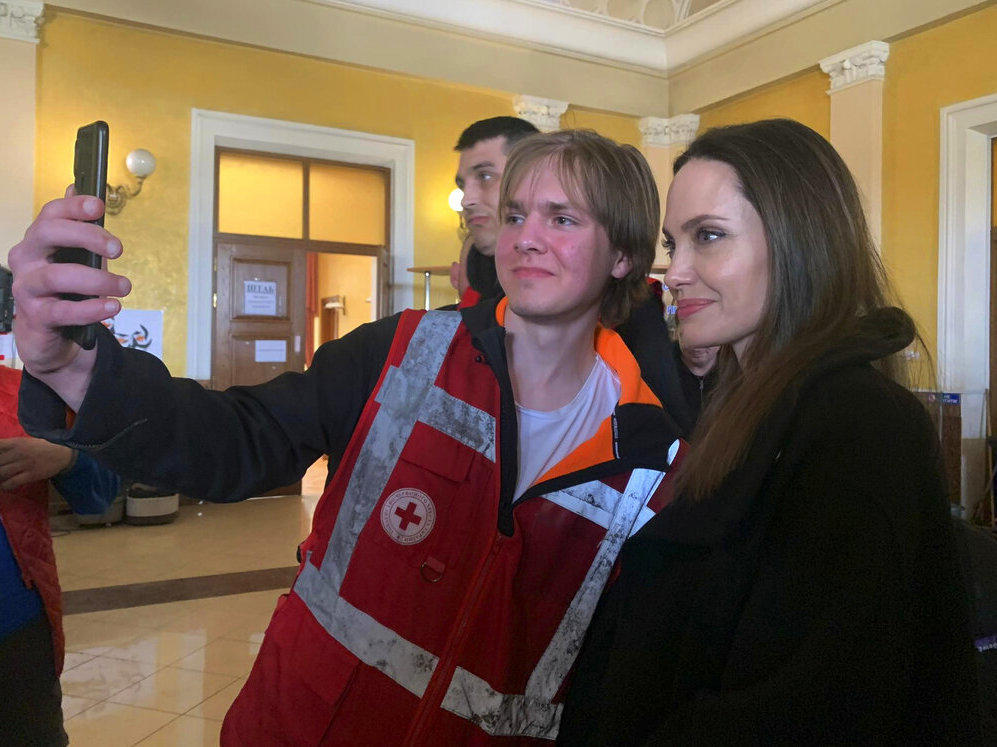 Angelina Jolie, Hollywood movie star and UNHCR goodwill ambassador, poses Saturday for photo with her fans in Lviv, Ukraine.