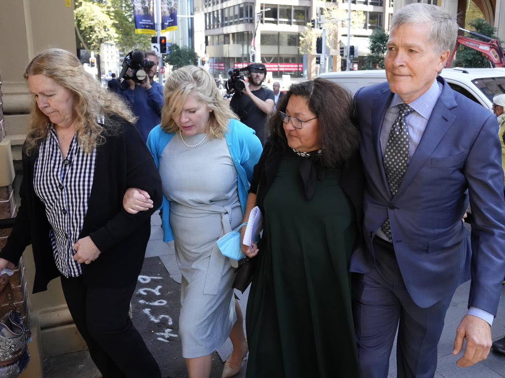 Steve Johnson with his sisters, Terry, left, and Rebecca and his wife Rosemarie, second right, arrive at the Supreme Court in Sydney on Monday for a sentencing hearing in the murder of Scott Johnson — Steve, Terry and Rebecca's brother.