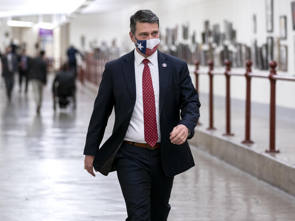 Rep. Ronny Jackson wears a protective mask while walking through the Cannon Tunnel to the U.S. Capitol on Jan. 12, 2021, days after a violent mob broke through police barriers trying to overturn the presidential election.