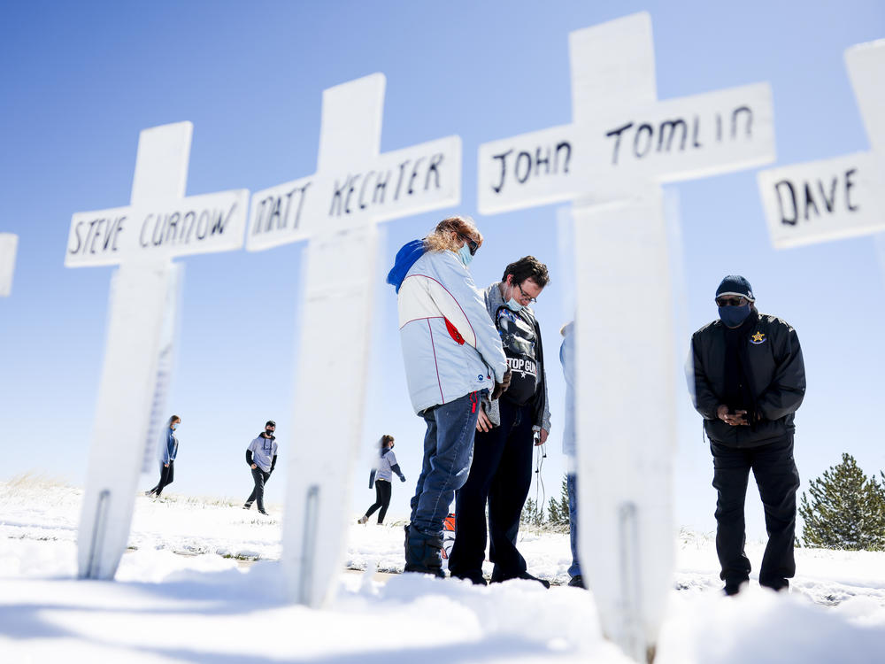 Mourners gather in Littleton, Colo., on April 20, 2021, to remember the victims of the 1999 Columbine High School shooting.