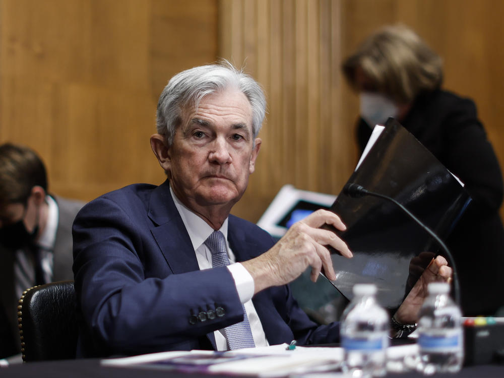 Federal Reserve Chair Jerome Powell collects his notebooks as he testifies before the Senate Banking Committee on March 3. The Fed is widely expected to raise interest rates by half a percentage point at its meeting this week.