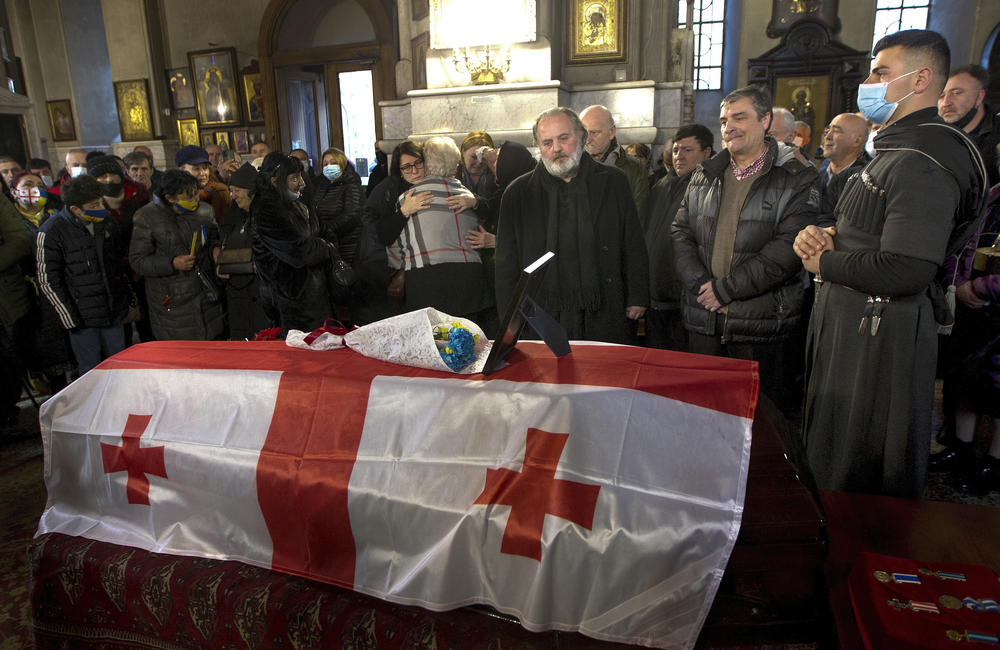 Russia's war in Ukraine has had an impact in other parts of the former Soviet Union. Here, relatives and friends mourn a  Georgian man killed when he went to fight on behalf of the Ukrainians. Russian troops have occupied part of Georgia since 2008. Russia has sent some of those troops from Georgia to Ukraine to fight there.