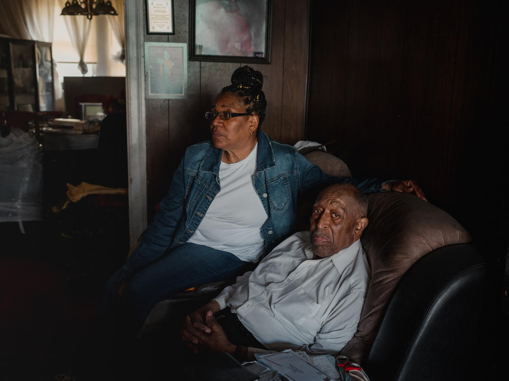 Veronica Stovall, left, helped her father, Joseph L. Davis, apply for a federally-funded energy-efficiency program in 2021. It turned up significant repair needs.