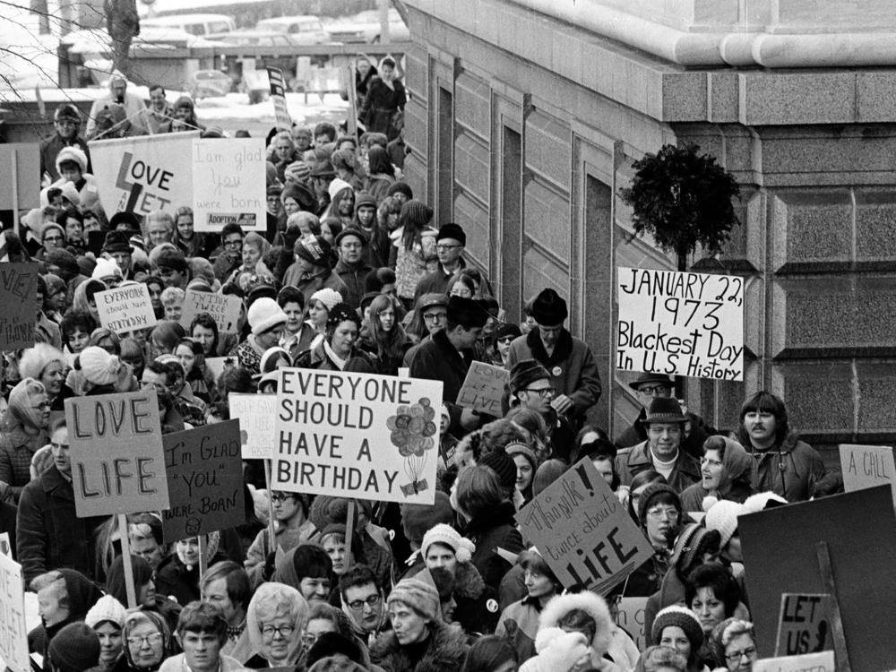 People march around the Minnesota Capitol building protesting the U.S. Supreme Court's Roe v. Wade decision in St. Paul, Minn., in January.