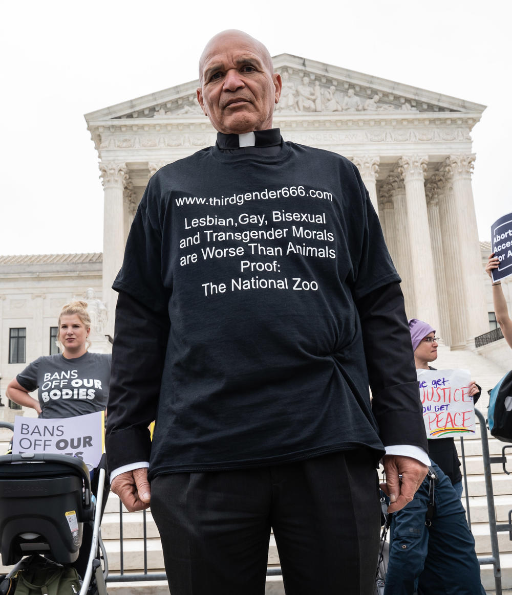 Abortion-rights opponent Rev. Leroy Swailes stands outside the U.S. Supreme Court building Tuesday.