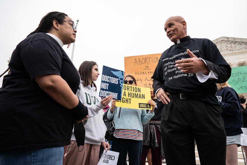 Abortion-rights supporter the Rev. Dr. Sofia Betancourt debates with abortion-rights opponent Minister Leroy Swailes outside U.S. Supreme Court on Tuesday.