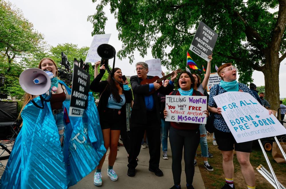 Protesters gather outside the U.S. Supreme Court building Tuesday.