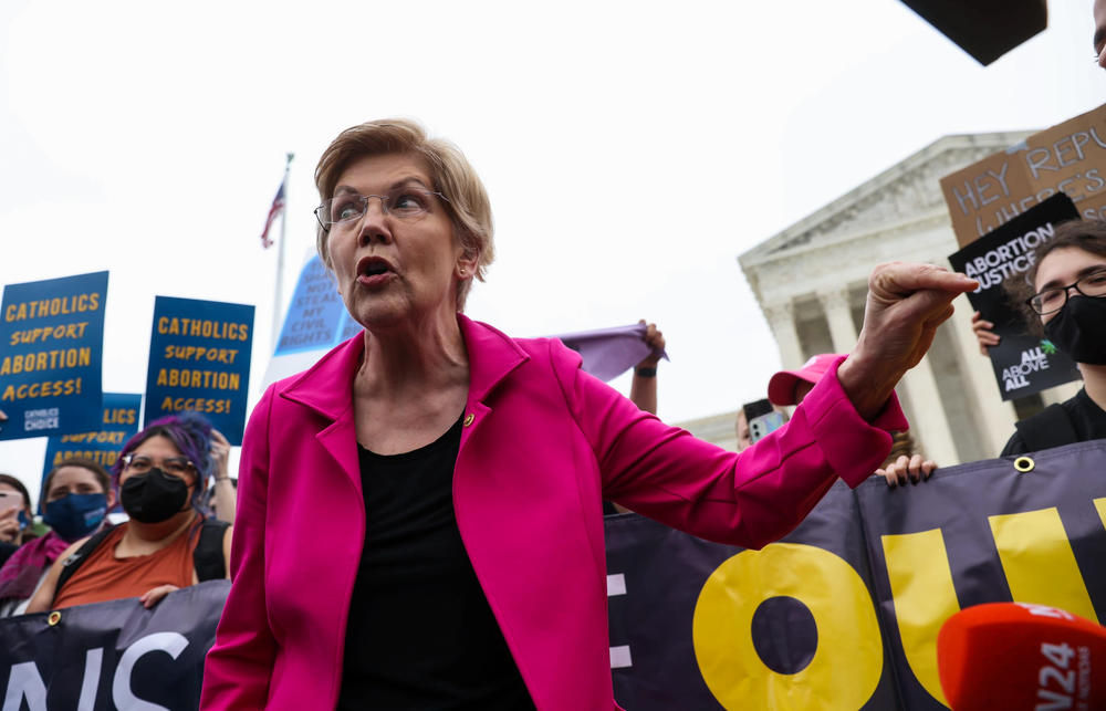 U.S. Sen. Elizabeth Warren, D-Mass., stands alongside abortion-rights supporters outside the U.S. Supreme Court on Tuesday.
