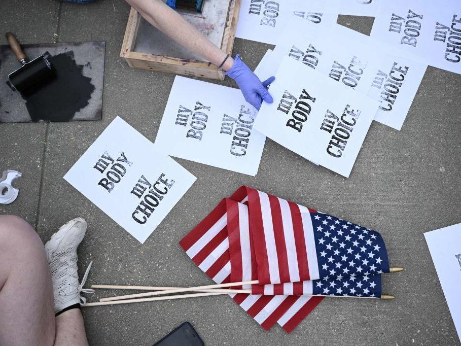 Pro-choice demonstrators make signs Tuesday in front of the U.S. Supreme Court in Washington.