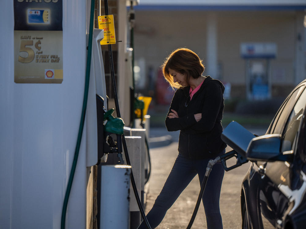 A person is pumping gas in Houston on April 1. Gas prices have risen further after Russia's invasion of Ukraine upended energy markets.