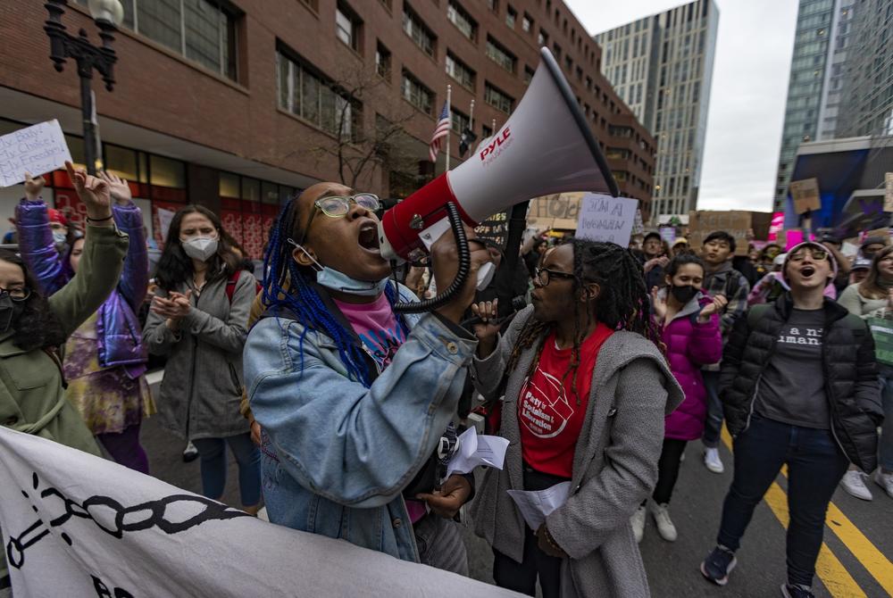 <strong>BOSTON:</strong> A protester chants through a megaphone as thousands of protesters march down Stuart Street during the Defend Abortion Rights rally.