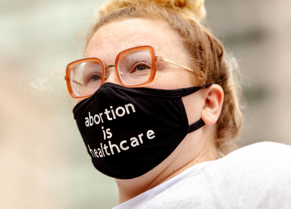 <strong>ST. LOUIS:</strong> Erin Barry, 28, of Maplewood, looks out to a crowd advocating for abortion rights on Tuesday at the Thomas F. Eagleton U.S. Courthouse in downtown St. Louis.