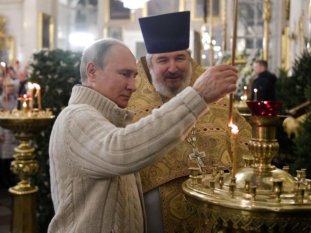 Russian President Vladimir Putin attends a Christmas liturgy at the Transfiguration Cathedral in St. Petersburg early on Jan. 7, 2020. In the U.S., Orthodox Christianity is a relatively small faith tradition, but in recent years, it has expanded to new regions. Some new converts are using the religion to spread white nationalist views.