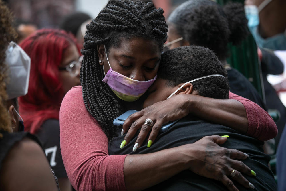 Friends and family mourn the death of Conrad Coleman Jr. following his funeral service in July of 2020 in New Rochelle, N.Y. Coleman, 39, died of COVID just over two months after his father also died of the disease.