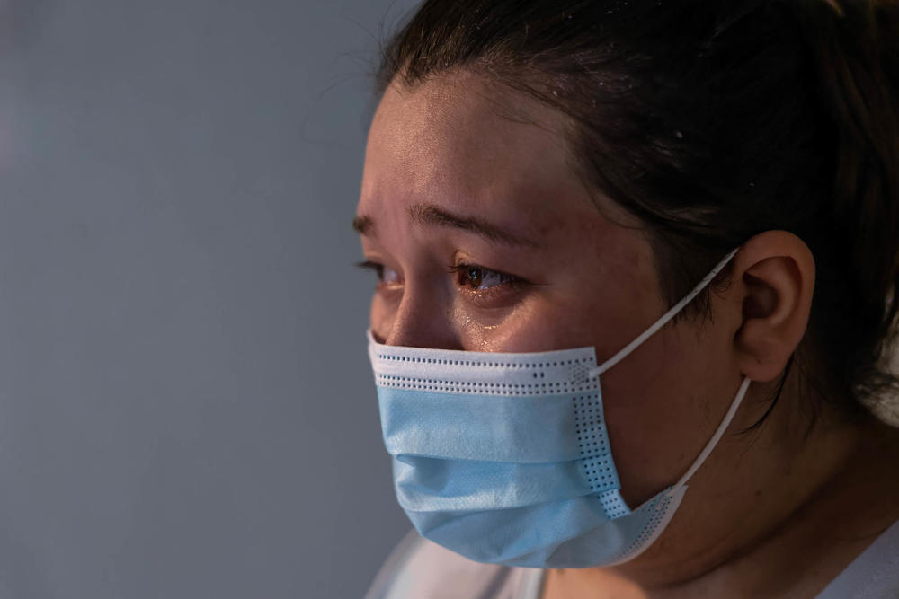 A COVID-positive woman, 25, grieves after her mother, 54, died at home of COVID-19 in September 2021 in Houston. She says they had planned to be vaccinated the following week.