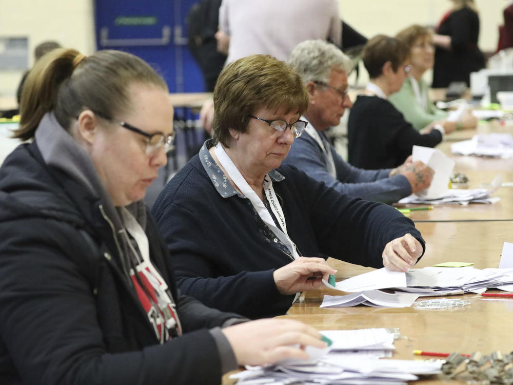 Ballot papers are counted at Peterborough Arena, for the local government elections, in Peterborough, England, Thursday, May 5, 2022.