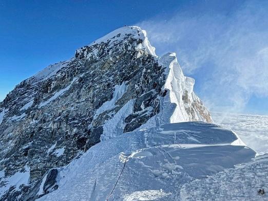 Kami Rita Sherpa climbed Mount Everest for the 26th time Saturday, setting a new world record for most times summitting the world's tallest peak.