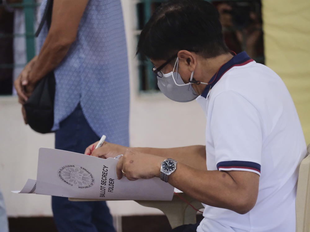 Presidential candidate Ferdinand Marcos Jr., the son of the late dictator, votes at a polling center in Batac City, Ilocos Norte, northern Philippines on Monday.