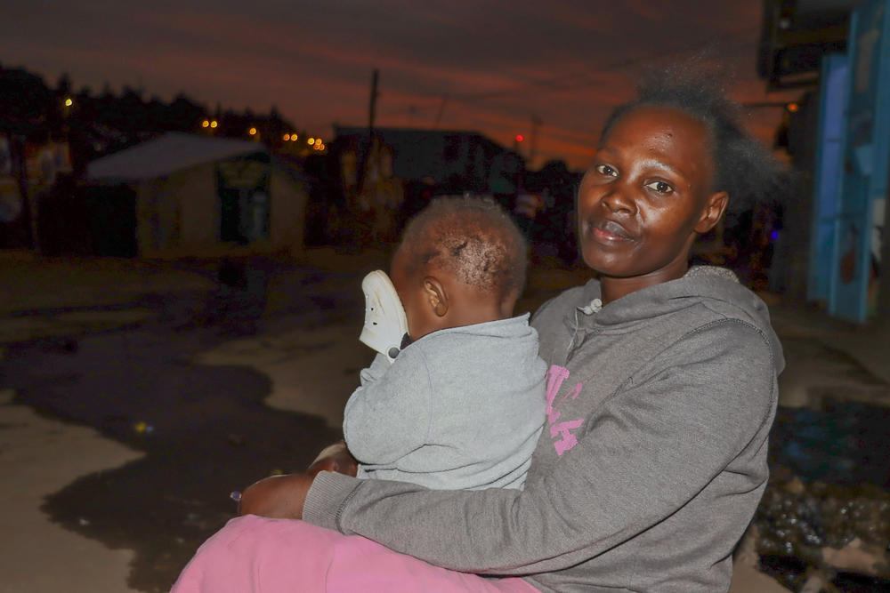Phillistus Indosh works as an outdoor food vendor, keeps her baby by her side and breastfeeds when necessary. She says her customers understand. She's not a fan of baby bottles because of the need for sterilization.