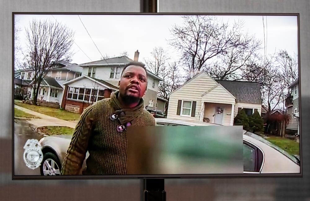 A TV display shows video evidence of a Grand Rapids police officer struggling with and shooting Patrick Lyoya at Grand Rapids City Hall on Wednesday, April 13. Lyoya, 26, was shot and killed about 8:10 a.m., on April 4, after what police said was a traffic stop.