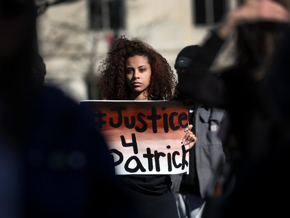 Supporters and family members of Patrick Lyoya, 26, participate in a rally in front of the Michigan state capital building to call on the Grand Rapids police department to name, arrest and prosecute the officer that shot Lyoya. Lyoya, an immigrant from the Democratic Republic of the Congo, died after being shot in the back of the head by a Grand Rapids police officer following a traffic stop.