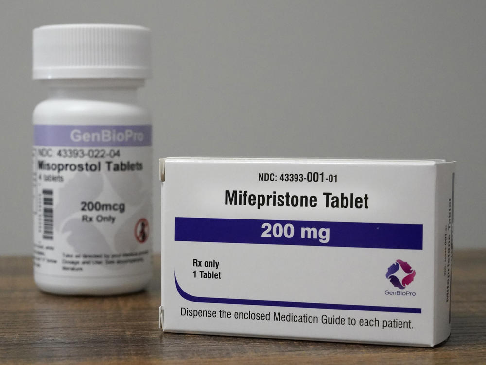 Containers of mifepristone and misoprostol — medications used to end a pregnancy — sit on a table inside of a Planned Parenthood clinic in Fairview Heights, Ill.