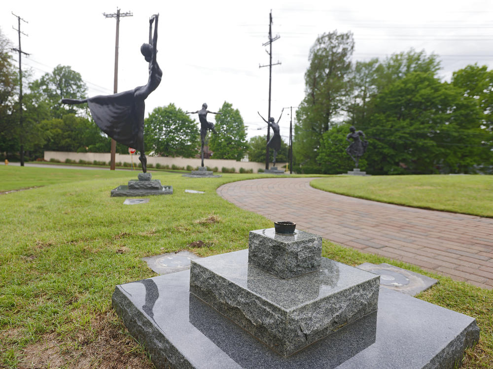 The base where the Marjorie Tallchief sculpture once stood is seen outside the Tulsa Historical Society on May 2 in Tulsa, Okla.