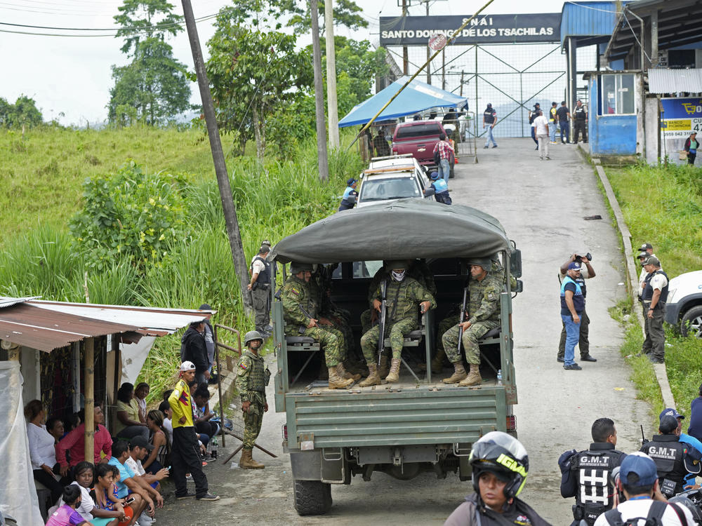 Soldiers patrol outside Bellavista prison where a deadly riot broke out overnight in Santo Domingo de los Tsachilas, Ecuador, on Monday.