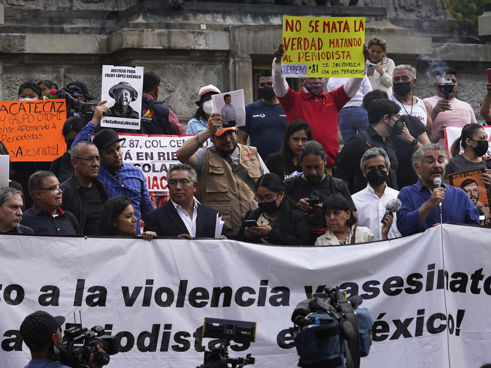 Journalists protest to draw attention to the latest wave of journalist killings, at the Angel of Independence monument in Mexico City, May 9, 2022.