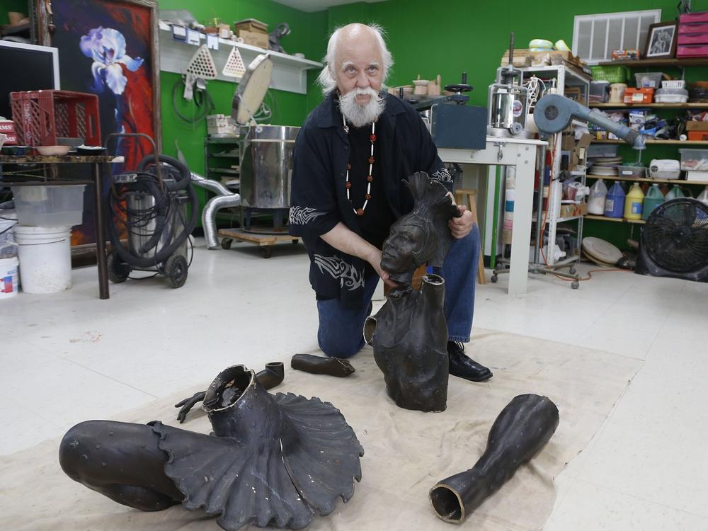 Sculptor Gary Henson, who made the Marjorie Tallchief statue that was stolen from the Tulsa Historical Society and cut up for scrap metal, on Monday shows the parts which he will reassemble at the Boys and Girls Club in Chelsea, Okla.