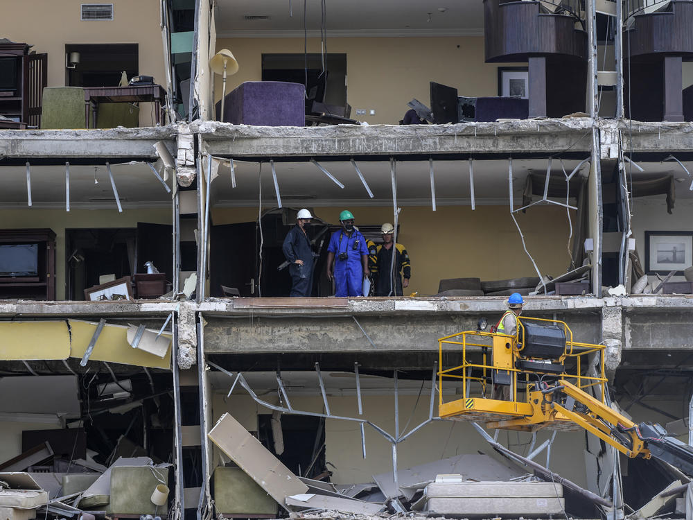 Rescue workers search through rooms days after a deadly explosion destroyed the five-star Hotel Saratoga in Old Havana, Cuba.