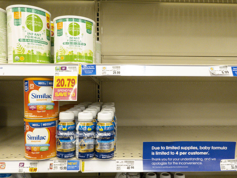Baby formula is displayed on the shelves of a grocery store with a sign limiting purchases in Indianapolis on Tuesday.