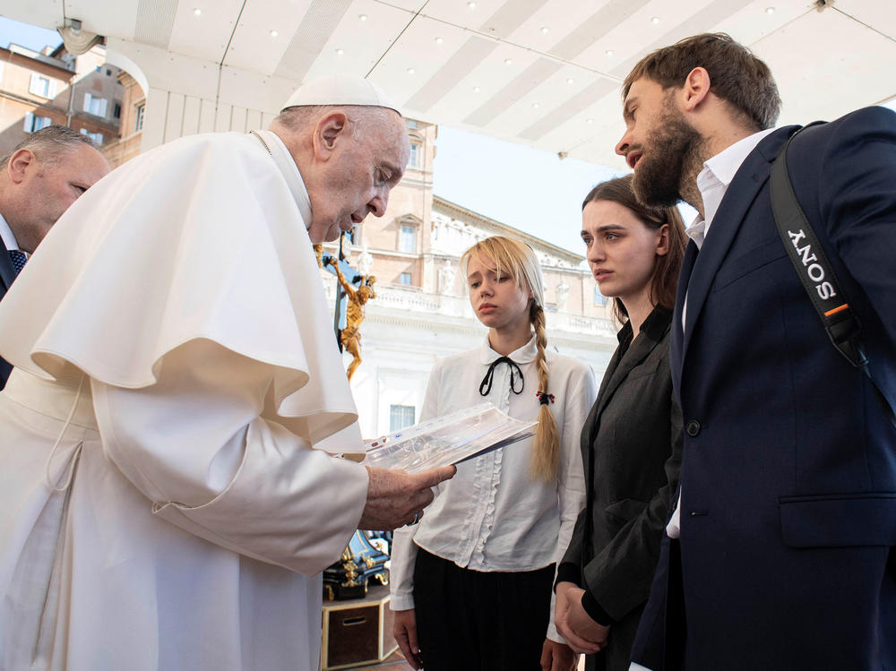 Wives of Ukrainian soldiers holed up inside the Azovstal steel plant in Mariupol meet with Pope Francis during the weekly general audience at the Vatican, Wednesday.