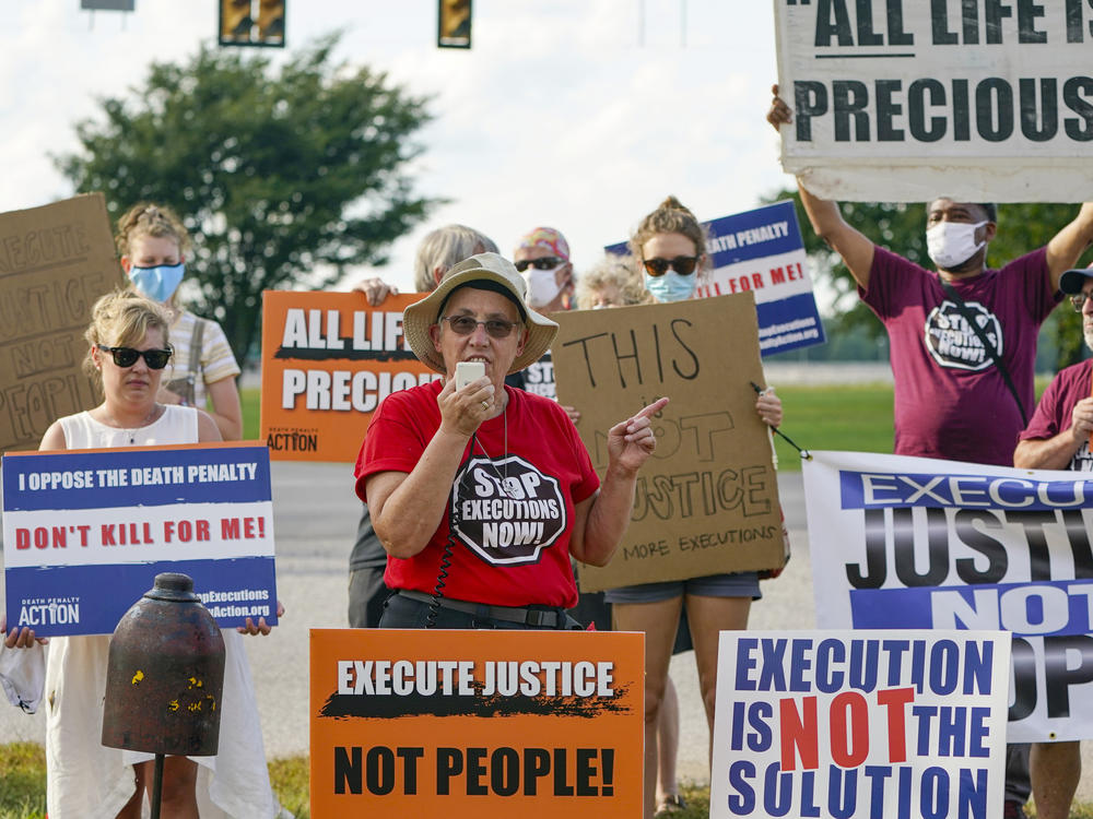 A protest is held against the death penalty, across the street from the federal prison complex in Terre Haute, Ind. in August 2020.