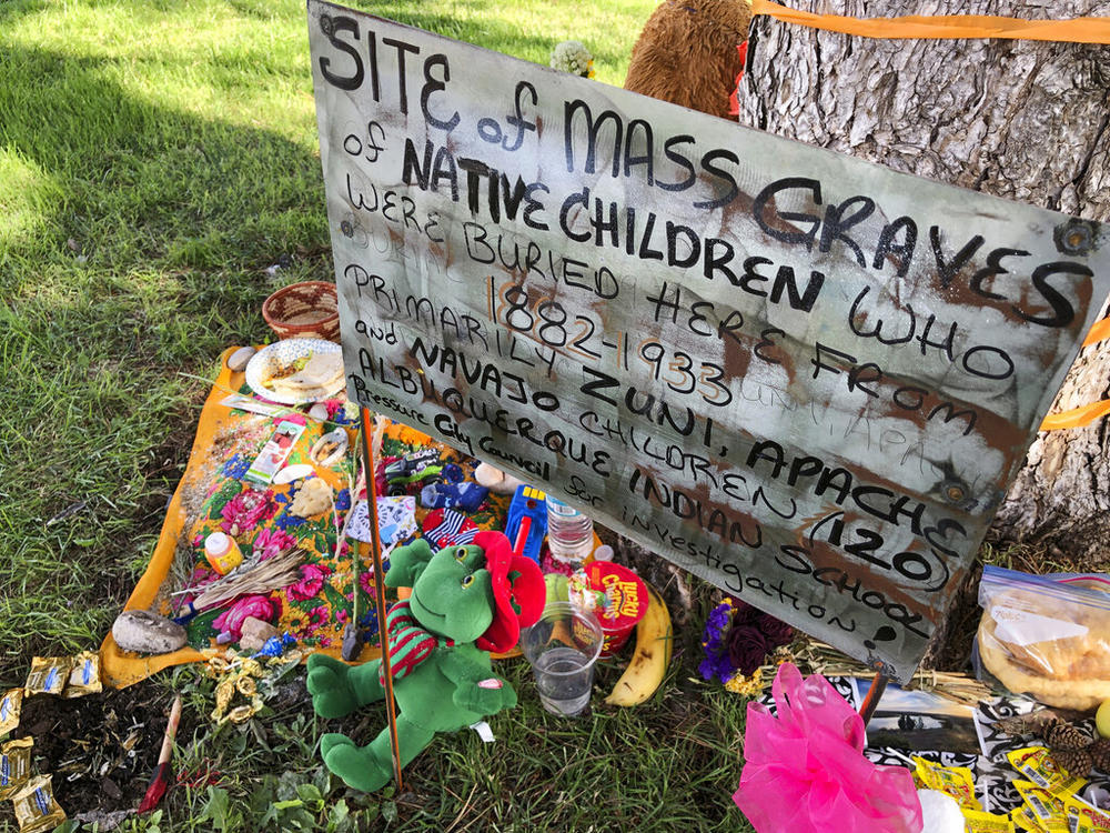 A makeshift memorial for the dozens of Indigenous children who died more than a century ago while attending a boarding school that was once located nearby is displayed under a tree at a public park in Albuquerque, N.M., in 2021.