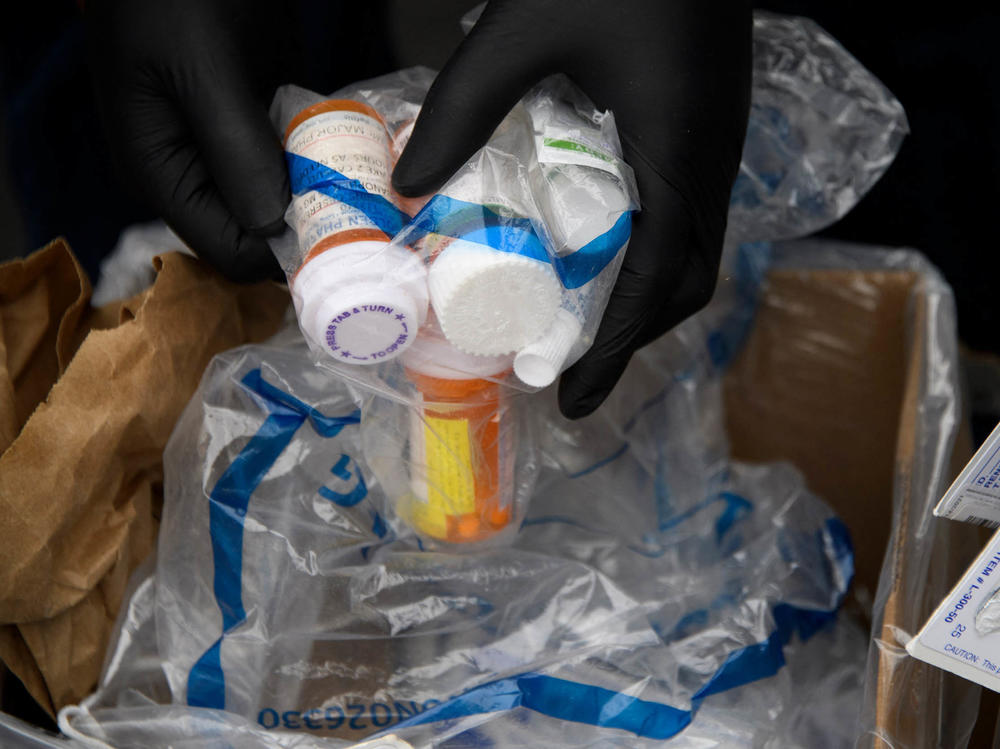 Containers of pills and prescription drugs are boxed for disposal during the Drug Enforcement Administration's 20th National Prescription Drug Take Back Day on April 24, 2021. Nearly 108,000 people died in 2021 from drug overdoses.