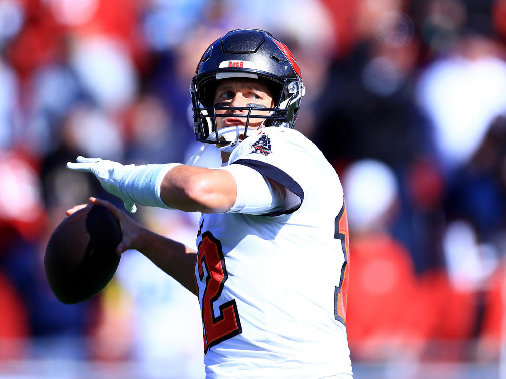 Tom Brady of the Tampa Bay Buccaneers warms up prior to playing the Los Angeles Rams in the NFC Divisional Playoff game in January.