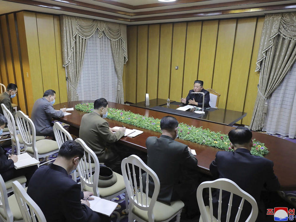In this photo provided by the North Korean government, North Korean leader Kim Jong Un, top, visits state emergency epidemic prevention headquarters in North Korea Thursday, May 12, 2022.