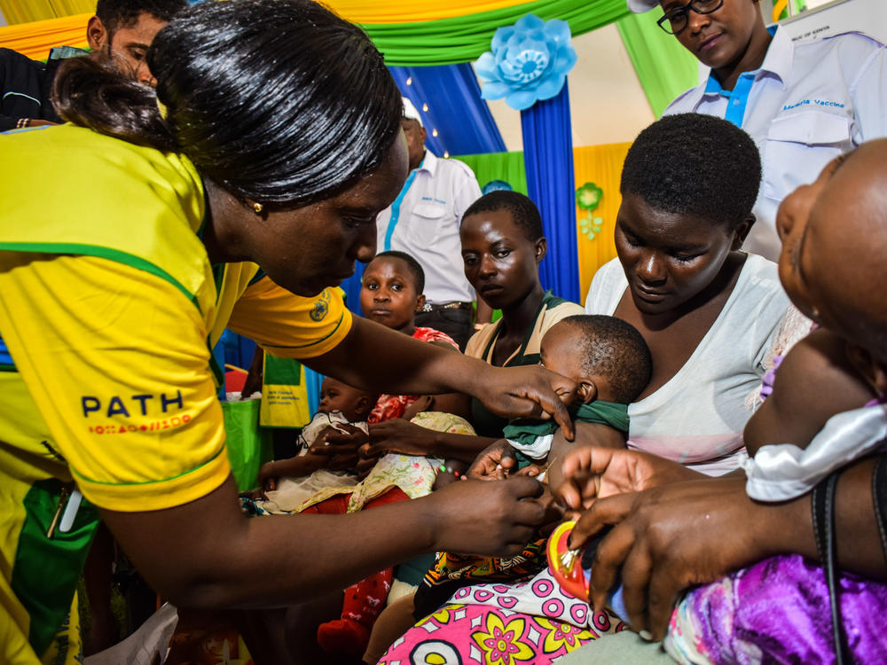 A health worker vaccinates a Kenyan child with the world's first malaria vaccine. Kenya has given at least one dose to 300,000 children so far.