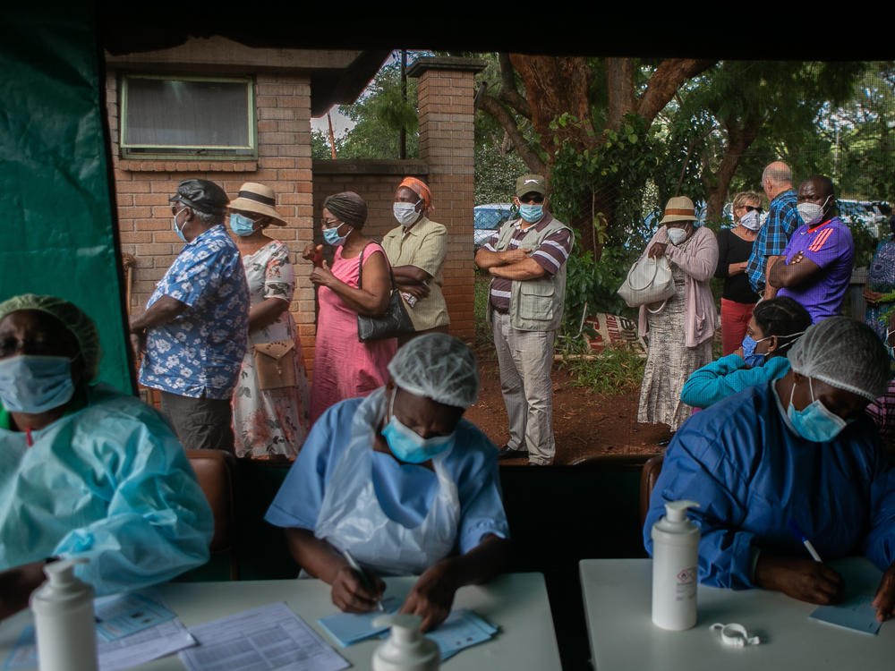 People line up to get the Sinopharm vaccine in Harare, Zimbabwe. World leaders promised to speed up vaccine distribution to low- and middle-income countries at the White House's second Global COVID-19 Summit on May 12.