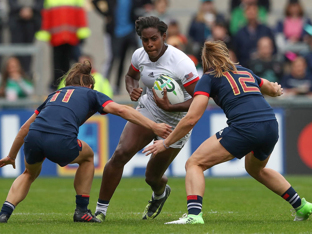 Naya Tapper of the USA is tackled by Camille Grassineau (left) and Elodie Poublan of France during the 2017 Women's Rugby World Cup third-place match in Belfast. The U.S. will host the women's tournament for the first time in 2033.