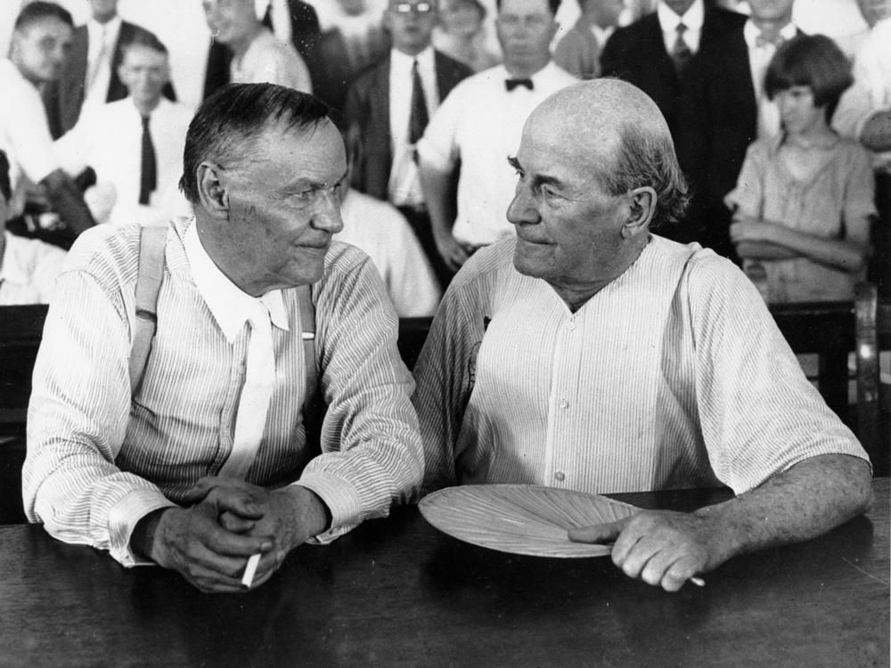 Clarence Darrow, left, and William Jennings Bryan speak with each other during the monkey trial in Dayton, Tenn., in July 1925.