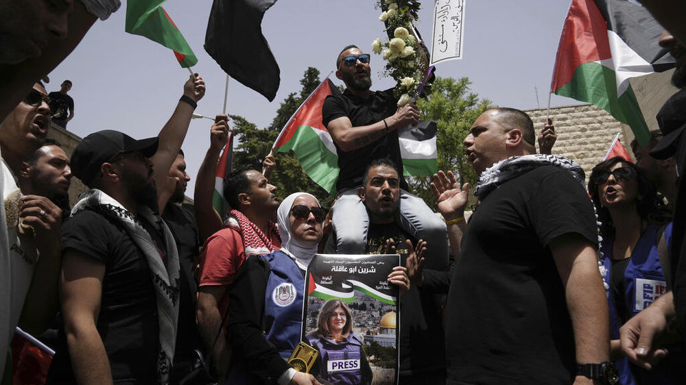 Mourners gather Friday at the hospital where the body of slain Al Jazeera veteran journalist Shireen Abu Akleh will be taken from to to her final resting place, in east Jerusalem.