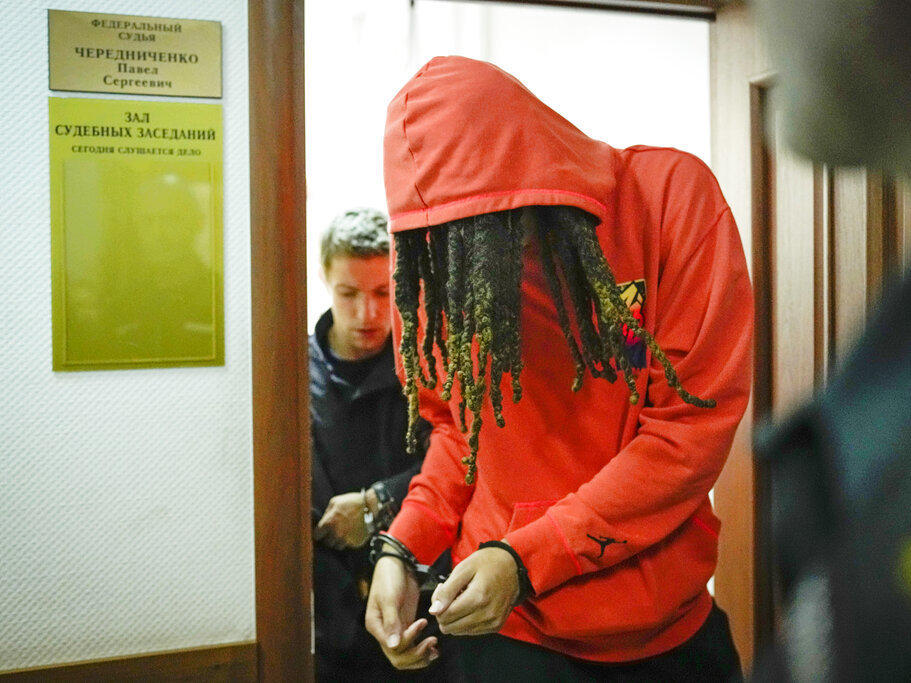 WNBA star and two-time Olympic gold medalist Brittney Griner leaves a courtroom in Khimki just outside Moscow, on Friday.