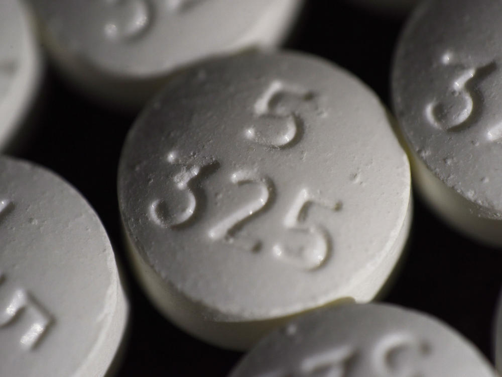 An arrangement of pills of the opioid oxycodone-acetaminophen in New York. Idaho officials on Friday agreed to a $119 million settlement with drugmaker Johnson & Johnson and three major distributors over their role in the opioid addiction crisis.