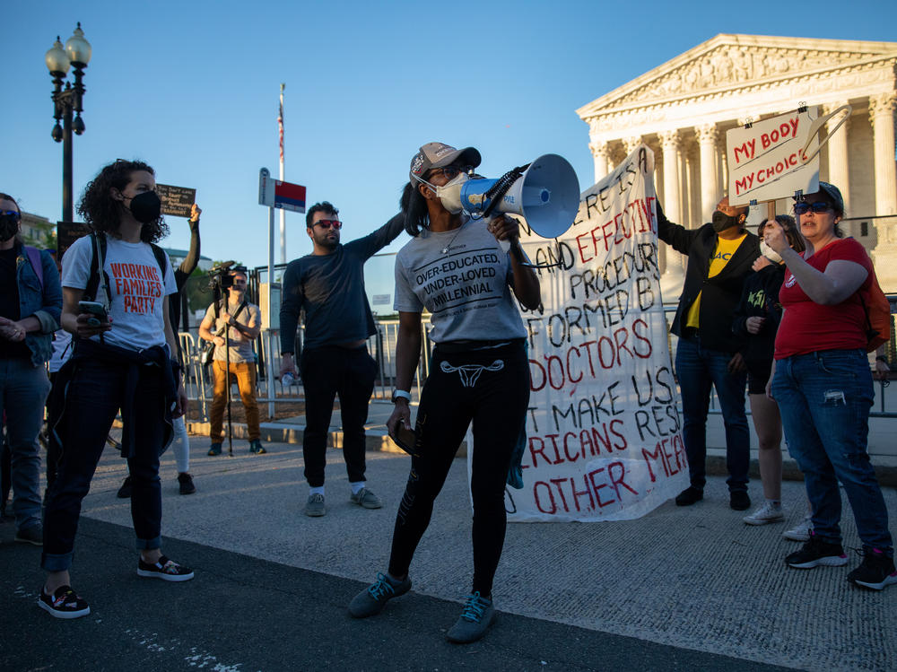 Abortion rights demonstrators chant during a protest outside the Supreme Court on Tuesday.