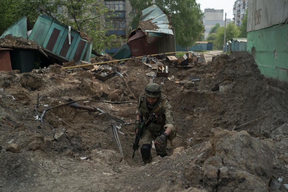 A special task force policeman inspects a site following an airstrike by Russian forces in Lysychansk, Luhansk region, Ukraine, on Friday.