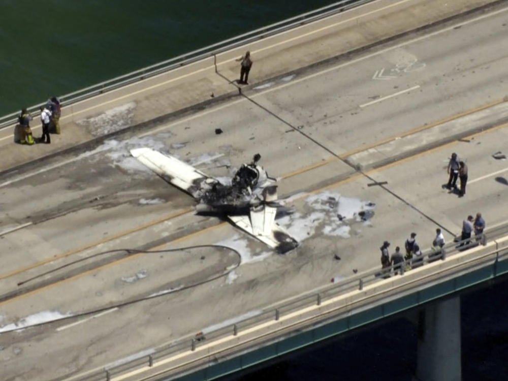 Emergency personnel respond to a small plane crash in Miami on Saturday.