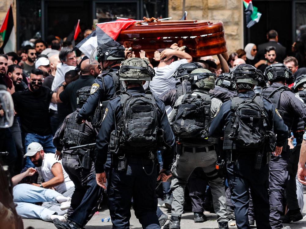 Israel's police chief orders an investigation into officers' conduct during Friday's funeral of Al Jazeera journalist Shireen Abu Akleh, who was killed while covering an Israeli arrest raid in a Palestinian refugee camp.
