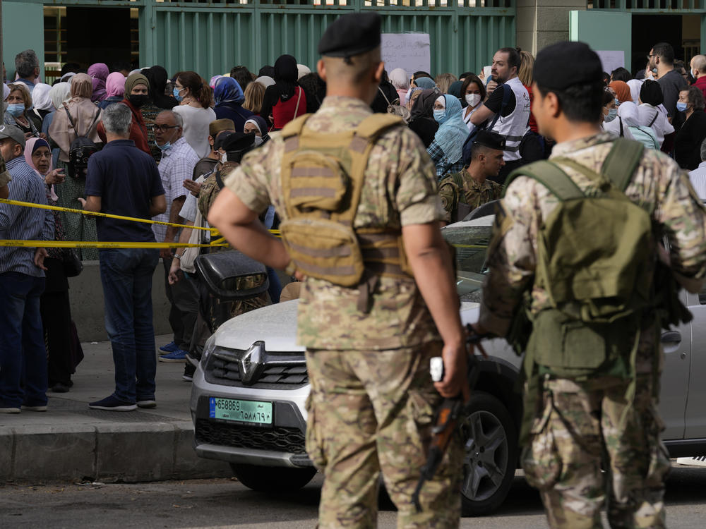 People line up to vote during parliamentary elections in Beirut, Lebanon Sunday, May 15, 2022.